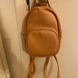 a creamy orange mini backpack 🧡